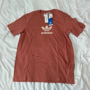 adidas logo tshirt  size medium   NWT  details: -short sleeve top  -emellished